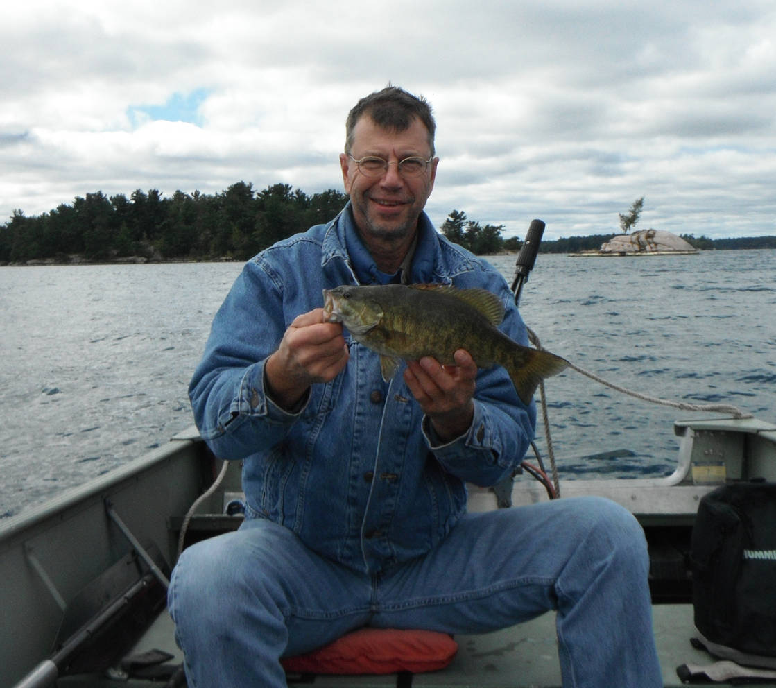 Greg holding a large yellow perch